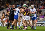 24 July 2016; Referee Alan Kelly tries to seperate players from both sides during the GAA Hurling All-Ireland Senior Championship quarter final match between Wexford and Waterford at Semple Stadium in Thurles, Co Tipperary. Photo by Ray McManus/Sportsfile