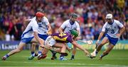 24 July 2016; Conor McDonald of Wexford in action against Waterford players, from left, Tadhg de Burca, Jamie Barron and Shane Fives during the GAA Hurling All-Ireland Senior Championship quarter final match between Wexford and Waterford at Semple Stadium in Thurles, Co Tipperary. Photo by Stephen McCarthy/Sportsfile