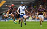 24 July 2016; Austin Gleeson of Waterford in action against Lee Chin, left, and Eoin Conroy of Wexford  during the GAA Hurling All-Ireland Senior Championship quarter final match between Wexford and Waterford at Semple Stadium in Thurles, Co Tipperary. Photo by Ray McManus/Sportsfile
