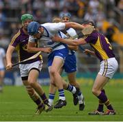 24 July 2016; Austin Gleeson of Waterford in action against Diarmuid O’Keeffe, 5, and Matthew O’Hanlon of Wexford during the GAA Hurling All-Ireland Senior Championship quarter final match between Wexford and Waterford at Semple Stadium in Thurles, Co Tipperary. Photo by Ray McManus/Sportsfile
