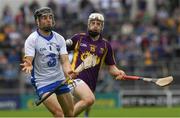 24 July 2016; Jamie Barron of Waterford  in action against David Dunne of Wexford during the GAA Hurling All-Ireland Senior Championship quarter final match between Wexford and Waterford at Semple Stadium in Thurles, Co Tipperary. Photo by Ray McManus/Sportsfile