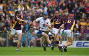 24 July 2016; Austin Gleeson of Waterford in action against Wexford players, left to right, Éanna Martin, Diarmuid O'Keeffe, and Paudie Foley, during the GAA Hurling All-Ireland Senior Championship quarter final match between Wexford and Waterford at Semple Stadium in Thurles, Co Tipperary. Photo by Daire Brennan/Sportsfile