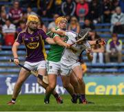24 July 2016; James Henebery and Darren Byrne of Wexford in action against Cian Magnier Flynn of Limerick during the Electric Ireland GAA Hurling All-Ireland Minor Championship quarter final match between Wexford and Limerick at Semple Stadium in Thurles, Co Tipperary. Photo by Ray McManus/Sportsfile