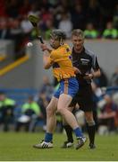 2 July 2016; Tony Kelly of Clare takes a free watched  by referee Barry Kelly during the GAA Hurling All-Ireland Senior Championship Round 1 match between Clare and Laois at Cusack Park in Ennis, Co Clare. Photo by Piaras Ó Mídheach/Sportsfile