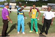 24 July 2016; Zouks captain Daren Sammy flips the coin as Amazon Warriors captain Rayad Emrit looks on  during Match 23 of the Hero Caribbean Premier League match between St Lucia Zouks and Guyana Amazon Warriors at the Daren Sammy Cricket Stadium in Gros Islet, St Lucia. Photo by Ashley Allen/Sportsfile