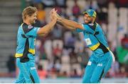 24 July 2016; Zouks bowler (L) Shane Watson celebrates with team mate Grant Elliott (R) after getting the wicket of Chris Lynn during Match 23 of the Hero Caribbean Premier League match between St Lucia Zouks and Guyana Amazon Warriors at the Daren Sammy Cricket Stadium in Gros Islet, St Lucia.