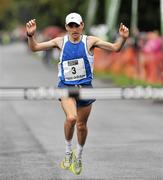 18 September 2010; Alan O'Shea, from Bantry, Co. Cork, crosses the finishing line to win the Lifestyle Sports - adidas Dublin Half Marathon. Phoenix Park, Dublin. Picture credit: Barry Cregg / SPORTSFILE