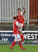 18 September 2010; Ryan Guy, St. Patrick's Athletic, is lifted in celebration by team-mate James O'Brien after scoring his side's first goal. FAI Ford Cup Quarter-Final, St. Patrick's Athletic v Sporting Fingal, Richmond Park, Inchicore, Dublin. Picture credit: Barry Cregg / SPORTSFILE