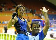 18 September 2010; Mary Kom, India, is held aloft by her coach after defeating Steluta Duta, Romania, during their 45-48kg Light-fly-weight Final. AIBA Women World Boxing Championships Barbados 2010 - Finals, Garfield Sober Sports Gymnasium, Bridgetown, Barbados. Picture credit: Stephen McCarthy / SPORTSFILE