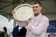 25 July 2016; Jockey Barry Browne celebrates with the trophy after winning the Connacht Hotel (Q.R.) Handicap on Swamp Fox at the Galway Races in Ballybrit, Co Galway. Photo by Cody Glenn/Sportsfile