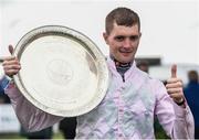 25 July 2016; Jockey Barry Browne celebrates with the trophy after winning the Connacht Hotel (Q.R.) Handicap on Swamp Fox at the Galway Races in Ballybrit, Co Galway. Photo by Cody Glenn/Sportsfile