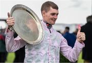 25 July 2016; Jockey Barry Browne celebrates with the trophy after winning the Connacht Hotel (Q.R.) Handicap on Swamp Fox at the Galway Races in Ballybrit, Co Galway. Photo by Cody Glenn/Sportsfile