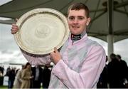 25 July 2016; Jockey Barry Browne celebrates with the trophy after winning the Connacht Hotel (Q.R.) Handicap on Swamp Fox at the Galway Races in Ballybrit, Co Galway. Photo by Cody Glenn/Sportsfile