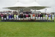 26 July 2016; Jockeys observe a minute silence for the late jockey John Thomas McNamara after race one at the Galway Races in Ballybrit, Co Galway. Photo by Cody Glenn/Sportsfile