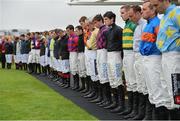 26 July 2016; Jockeys observe a minute silence for the late jockey John Thomas McNamara in the parade ring at the Galway Races in Ballybrit, Co Galway. Photo by Cody Glenn/Sportsfile