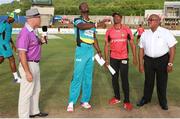26 July 2016; St Lucia Zouks captain Daren Sammy flips the coin as Trinbago Knight Riders captain Dwayne Bravo looks on during the Hero Caribbean Premier League (CPL) Match 24 between St Lucia Zouks and Trinbago Knight Riders at the Daren Sammy Cricket Stadium in Gros Islet, St Lucia. Photo by Ashley Allen/Sportsfile