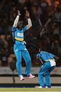 26 July 2016; St Lucia Zouks Daren Sammy (L) and Jerome Taylor (R) celebrate the wicket of Brendon McCullum during the Hero Caribbean Premier League (CPL) Match 24 between St Lucia Zouks and Trinbago Knight Riders at the Daren Sammy Cricket Stadium in Gros Islet, St Lucia. Photo by Ashley Allen/Sportsfile
