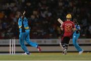 26 July 2016; St Lucia Zouks Delorn Johnson (L) celebrates the run out of Trinbago Knight Riders Colin Munro (R) during the Hero Caribbean Premier League (CPL) Match 24 between St Lucia Zouks and Trinbago Knight Riders at the Daren Sammy Cricket Stadium in Gros Islet, St Lucia. Photo by Ashley Allen/Sportsfile