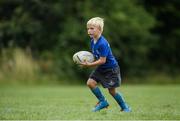 27 July 2016; Luke Carthy, aged 6, from Celbridge, Co. Kildare, in action during the Bank of Ireland Leinster Rugby Summer Camp at Clondalkin RFC in Kingswood Cross, Dublin. Photo by Daire Brennan/Sportsfile