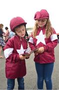 27 July 2016; Cousins Alan Jordan, age 7, and Emma Rennicks, age 7, from Navan, Co Meath, study the form together ahead of the Galway Races in Ballybrit, Co Galway. Photo by Cody Glenn/Sportsfile