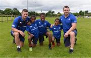 27 July 2016; Leinster's Fergus McFadden, left, and Cian Healy, with brothers, from left, Ola Amoo, age 10, Thomas Amoo, age 12, and Brian Amoo, age 8, during the Bank of Ireland Leinster Rugby Summer Camp at Cill Dara RFC in Dunmurray West, Kildare. Photo by Piaras Ó Mídheach/Sportsfile