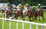 27 July 2016; Eventual winner Our Kylie, second from right, with Danny Mullins up, races alongside Floral Fantasy, far right, with Mark Walsh up, who finished second, and Give Her Bach, with Pierce Gallagher up, who finished third, while Davy Russell falls from Crystal Pearl, as they round the final bend to win the Tote European Breeders Fund Mares Handicap Hurdle at the Galway Races in Ballybrit, Co Galway. Photo by Cody Glenn/Sportsfile