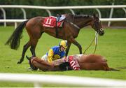 27 July 2016; Jockey Jonathan Moore after falling from The Conker Club in an incident also involving Crystal Pearl, number 11, during the Tote European Breeders Fund Mares Handicap Hurdle at the Galway Races in Ballybrit, Co Galway. Photo by Cody Glenn/Sportsfile