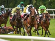 27 July 2016; Eventual winner Our Kylie,  right, with Danny Mullins up, races alongside Give Her Bach, with Pierce Gallagher up, who finished third, while Davy Russell falls from Crystal Pearl, as they round the final bend to win the Tote European Breeders Fund Mares Handicap Hurdle at the Galway Races in Ballybrit, Co Galway. Photo by Cody Glenn/Sportsfile