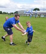 27 July 2016; Leinster's Cian Healy takes part in activities with Aidan Ryan, age 6, from Kilcullen, during the Bank of Ireland Leinster Rugby Summer Camp at Cill Dara RFC in Dunmurray West, Kildare. Photo by Piaras Ó Mídheach/Sportsfile