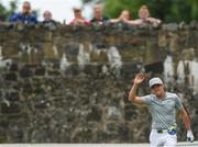 27 July 2016; Niall Horan of One Direction acknowledges supporters watching from a bridge on the 3rd tee during the The Northern Ireland Open Pro-Am at Galgorm Castle in Ballymena, Antrim. Photo by David Fitzgerald/Sportsfile