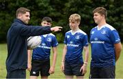 27 July 2016; Leinster Academy player Ian Fitzpatrick gives coaching advice to camp participants, from left, Dean Saunders, Fergus Stanley and Ben Griffin during a Leinster Rugby School of Excellence Camp at King's Hospital in Liffey Valley, Dublin. Photo by Sam Barnes/Sportsfile