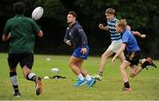 27 July 2016; Leinster Academy player Charlie Rock takes part in a drill with camp participants during a Leinster Rugby School of Excellence Camp at King's Hospital in Liffey Valley, Dublin.  Photo by Sam Barnes/Sportsfile