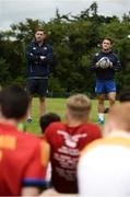 27 July 2016; Leinster Academy players, Ian Fitzpatrick, left, and  Charlie Rock, right, talk with participants during a Leinster Rugby School of Excellence Camp at King's Hospital in Liffey Valley, Dublin. Photo by Sam Barnes/Sportsfile