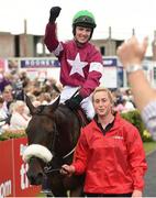 27 July 2016; Donagh Meyler enters the winner's enclousre on Lord Scoundrel after winning the TheTote.com Galway Plate Steeplechase Handicap at the Galway Races in Ballybrit, Co Galway. Photo by Cody Glenn/Sportsfile