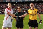 19 September 2010; The Cork on field captain Michael Shields greets his opposite number Brendan Coulter in the presence of referee David Goldrick. GAA Football All-Ireland Senior Championship Final, Down v Cork, Croke Park, Dublin. Picture credit: Ray McManus / SPORTSFILE