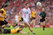 19 September 2010; Paul Kerrigan, Cork, races clear of Down defenders Kevin McKernan and Daniel McCartan, left. GAA Football All-Ireland Senior Championship Final, Down v Cork, Croke Park, Dublin. Picture credit: Ray McManus / SPORTSFILE