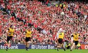 19 September 2010; Paul Kerrigan, Cork, scores a point to put Cork ahead in the second half, despite the attentions of Down players, from left, Kevin McKernan, Daniel McCartan, Damian Rafferty, and Conor Maginn. GAA Football All-Ireland Senior Championship Final, Down v Cork, Croke Park, Dublin. Picture credit: Brian Lawless / SPORTSFILE