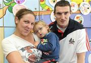 20 September 2010; Cork captain Graham Canty with Sam Herlihy, aged 2, and his mother Caroline, from Dún Laoghaire, Co. Dublin, during a team visit to Our Lady's Hospital for Sick Children, Crumlin, Dublin. Picture credit: Barry Cregg / SPORTSFILE