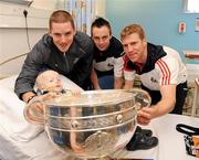 20 September 2010; Cork players, from left to right, Daniel Goulding, Paul Kerrigan, and Anthony Lynch with Max Doyle, aged 4, from Redcross, Co. Wicklow, during a team visit to Our Lady's Hospital for Sick Children, Crumlin, Dublin. Picture credit: Barry Cregg / SPORTSFILE