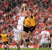 19 September 2010; Nicholas Murphy, Cork, catches the ball high above Kalum King and Benny Coulter, Down, in midfield. GAA Football All-Ireland Senior Championship Final, Down v Cork, Croke Park, Dublin. Picture credit: Oliver McVeigh / SPORTSFILE