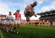 19 September 2010; Cork's Michael Shields jumps in the air as the teams prepare to parade around the pitch. GAA Football All-Ireland Senior Championship Final, Down v Cork, Croke Park, Dublin. Photo by Sportsfile
