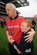 19 September 2010; Cork manager Conor Counihan celebrates with his son Oisin, aged 9, after the game. GAA Football All-Ireland Senior Championship Final, Down v Cork, Croke Park, Dublin. Photo by Sportsfile