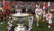 19 September 2010; Eoin Cadogan, left, and Michael Shields, Cork, run out on to the pitch past the Sam Maguire cup. GAA Football All-Ireland Senior Championship Final, Down v Cork, Croke Park, Dublin. Photo by Sportsfile