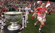 19 September 2010; Aidan Walsh and Alan Quirke, right, Cork, run out on to the pitch past the Sam Maguire cup. GAA Football All-Ireland Senior Championship Final, Down v Cork, Croke Park, Dublin. Photo by Sportsfile