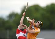 27 July 2016; Saul McCaughan of Antrim in action against Sean McGuigan of Derry during the Bord Gais Energy Ulster GAA Hurling U21 Championship Final match between Derry and Antrim at Loughgiel Shamrocks GAA Club in Belfast. Photo by David Fitzgerald/Sportsfile