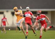 27 July 2016; Alec Delargy of Antrim in action against Eamon McGill of Derry during the Bord Gais Energy Ulster GAA Hurling U21 Championship Final match between Derry and Antrim at Loughgiel Shamrocks GAA Club in Belfast. Photo by David Fitzgerald/Sportsfile