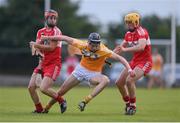 27 July 2016; Joe Maskey of Antrim in action against Eamon McGill, left, and Proinsias Burke of Derry during the Bord Gais Energy Ulster GAA Hurling U21 Championship Final match between Derry and Antrim at Loughgiel Shamrocks GAA Club in Belfast. Photo by David Fitzgerald/Sportsfile