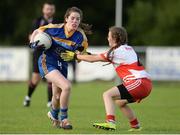 27 July 2016; Niamh Brady of Longford in action against Nikki Doherty of Derry during the All Ireland Ladies Football U16 ‘C’ Championship Final 2016 match between Derry and Longford at Fr. Hackett Park in Augher, Co Tyrone. Photo by Oliver McVeigh/Sportsfile