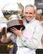28 July 2016; Ruby Walsh celebrates with the trophy after winning the Guinness Galway Hurdle Handicap on Clondaw Warrior at the Galway Races in Ballybrit, Co Galway. Photo by Cody Glenn/Sportsfile