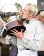 28 July 2016; Ruby Walsh kisses the trophy after winning the Guinness Galway Hurdle Handicap on Clondaw Warrior at the Galway Races in Ballybrit, Co Galway. Photo by Cody Glenn/Sportsfile